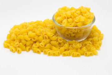 Macaroni pasta close up on glass blow, on white background