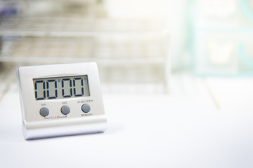 Timer count down laboratory equipment in over white tone.