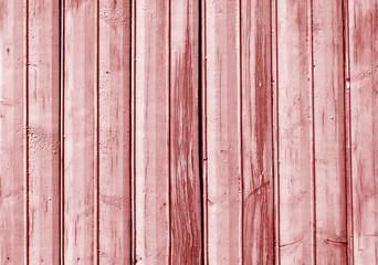 Red color old wooden fence texture.