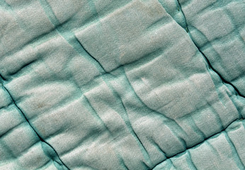 Old cyan color blanket texture.