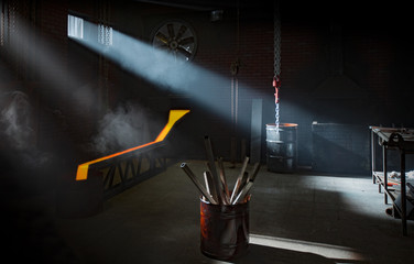 Blacksmith workshop interior with lightrays coming from windows