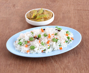 Indian food rice pilaf, which is a popular and traditional dish, and side dish curry made from long...