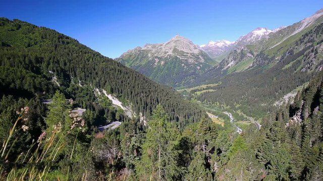 Mountain road leading through Malojapass -  high mountain pass in the Swiss Alps in the canton of Graub&uuml;nden, linking the Engadine with the Val Bregaglia, Switzerland
