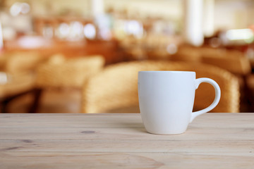 Cup of coffee on a wooden table.