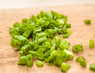 chopped green onions on a cutting board