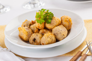 Fried battered mushrooms served on a plate