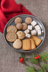 Homemade assorted christmas cookies on a metal plate for the holiday. Selective focus.