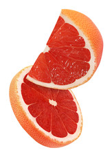 hanging, falling and flying piece of grapefruit fruits isolated on white background with clipping path