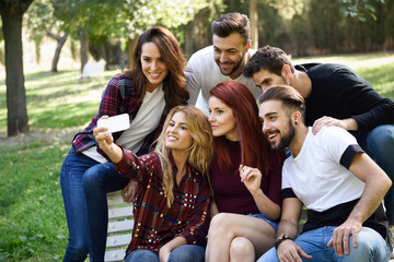 Fototapeta premium Group of friends taking selfie in urban background
