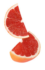 hanging, falling and flying piece of grapefruit fruits isolated on white background with clipping path