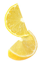 hanging, falling and flying piece of lemon fruits isolated on white background with clipping path