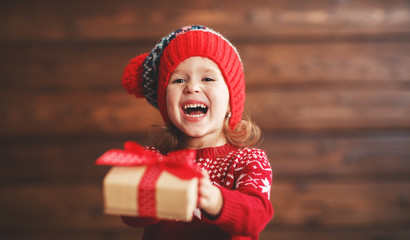 happy child girl with Christmas present