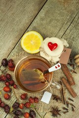 Natural treatment for colds and flu. Ginger lemon honey garlic and rosehip tea against influenza. Hot tea for colds. Home Pharmacy. Proven treatment of diseases. Folk medicine.
