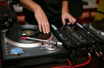 Hip hop DJ scratch vinyl records on turntable player
