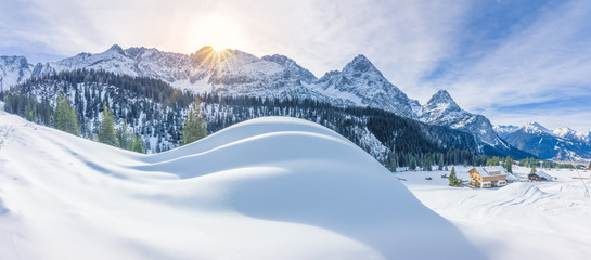 Mountain village and snowy Alps - Winter panorama with an Austrian village, the Alps mountains and...