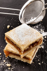homemade apple cinnamon cake sprinkled with powdered sugar