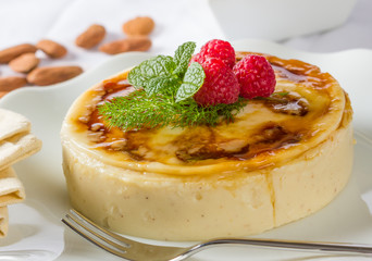 Rice pudding served with mint and raspberries.