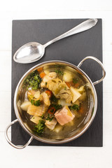 fish soup with vegetables in a bowl