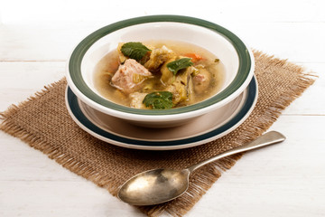 fish soup with vegetables in a bowl