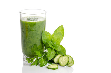 Green smoothie with cucumber, mint and parsley as healthy summer