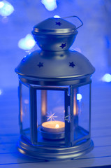 Christmas lantern with candle. Bokeh