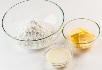 Buttercream ingredients in different bowls