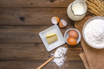baking background with raw eggs, butter and flour