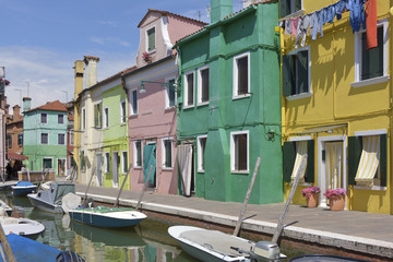 Fototapeta na wymiar Burano with its canal and boats. Burano is an island in the Venetian Lagoon, northern Italy