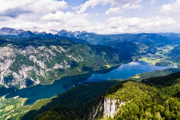 Naklejka na ściany i meble A view of the Lake Bohinj and the surrounding southern Alps mountains,Triglav national park, Slovenia