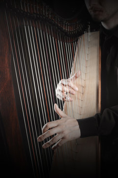 Harp player Irish harpist playing strings music instruments