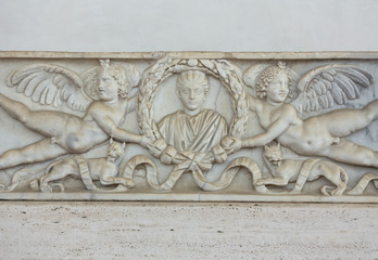 Relief on the ancient sarcophagus in the baths of Diocletian in Rome. Italy