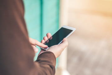 Close up of Man's hands with smartphone