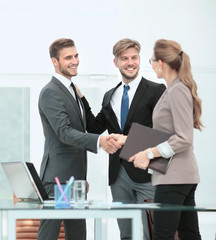 Business people shaking hands, finishing up a meeting