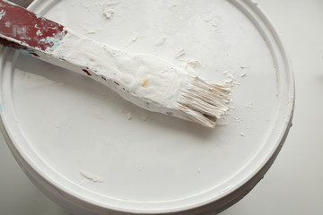 Paint brush with dry white paint 
