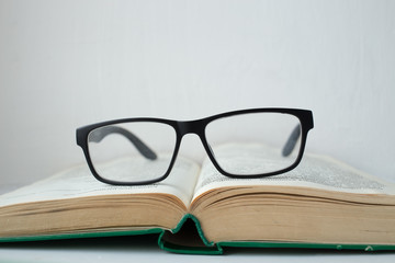 Glasses lying on the book