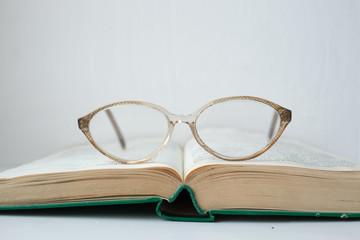 Glasses lying on the book