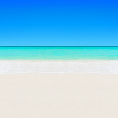 Tropical white sandy beach and turquoise clear ocean water backg