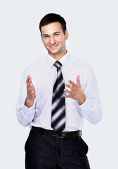 Smiling businessman telling, isolated over white