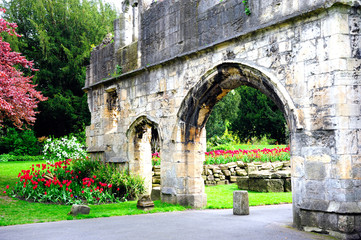 Fototapeta na wymiar Ruins of wall with arch door in St.Mary's Abbey, York, England, UK