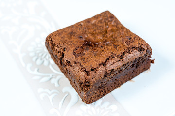 Chocolate Brownie cake on a dark plate