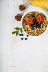 Granola with fruits on a wooden table