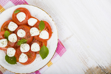 Caprese salad on a wooden table
