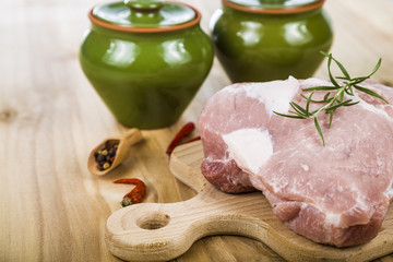 Raw pork on a wooden table