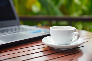 a cup of coffee and blurred bokeh background