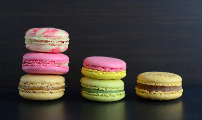 French colorful macarons with dark background