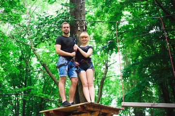 Hiking in the rope park two young people