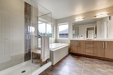 Fototapeta na wymiar White modern bathroom interior in brand-new house.