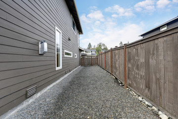 Fototapeta premium Side wall of Brown two story house