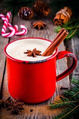 Christmas drink: hot white chocolate with cinnamon and anise in red mug