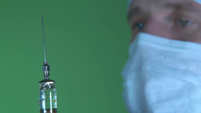 doctor checks the contents of the injection site